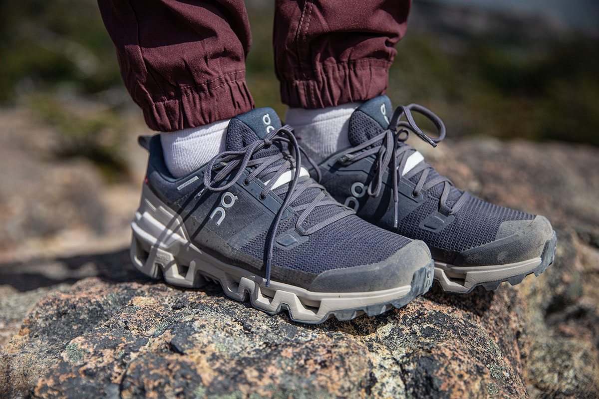 On Cloudwander Waterproof hiking shoes (standing on rock)