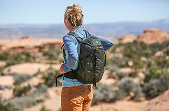 The REI Co-op Flash 22 daypack on a hike in the desert