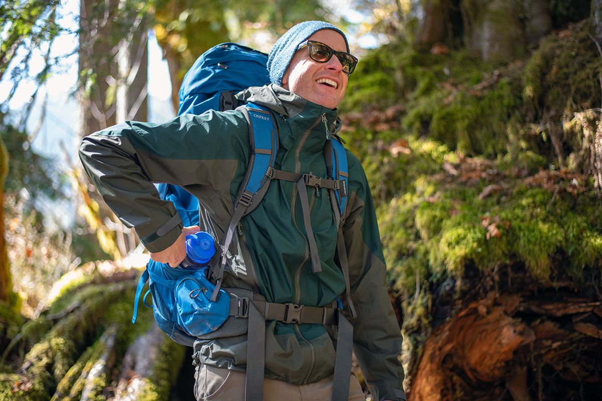 REI Co-op Stormbolt GTX hardshell jacket (smiling with pack on)