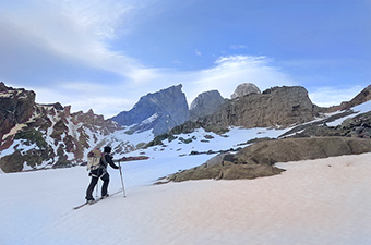 A woman is backcountry skiing in Patagonia.