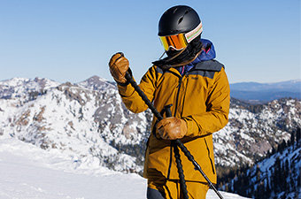 Trew Gear Astoria ski jacket (standing in mountains)