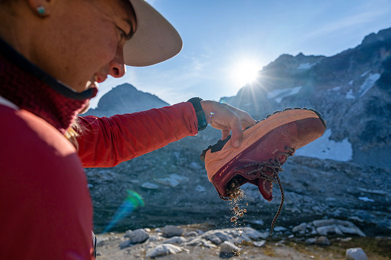 https://www.switchbacktravel.com/sites/default/files/images/landing-page/Footwear%20Reviews%20%28pouring%20pebbles%20out%20of%20Altra%20Olympus%20Hike%20GTX%20shoe%20m%29.jpg