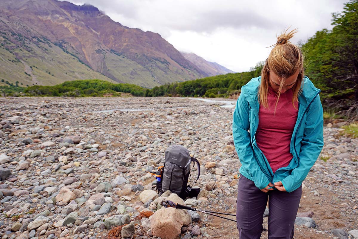 Black Diamond Alpine Start Hoody (putting on in river valley)