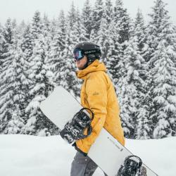 Ben carrying snowboard