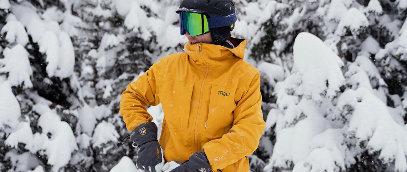 ​​Trew Gear Cosmic Primo Jacket (standing in front of snowy backdrop)