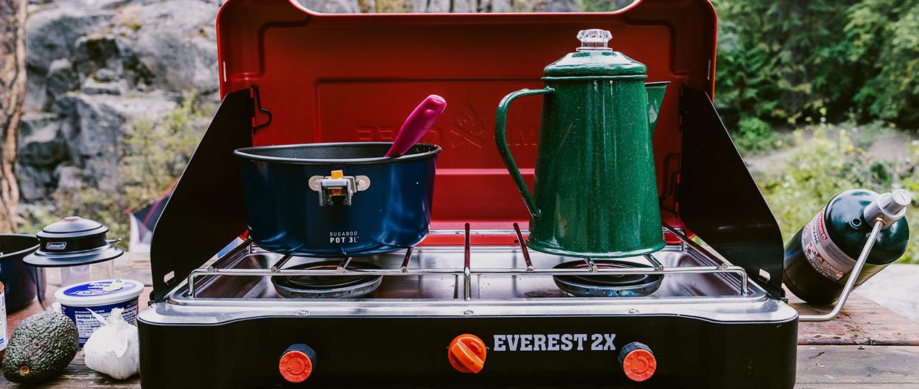 Camp stove (Camp Chef Everest 2X on picnic table)