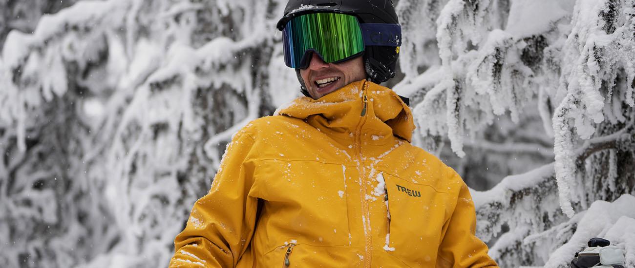 Ski jacket (snowy backdrop with Trew Gear Cosmic Primo)