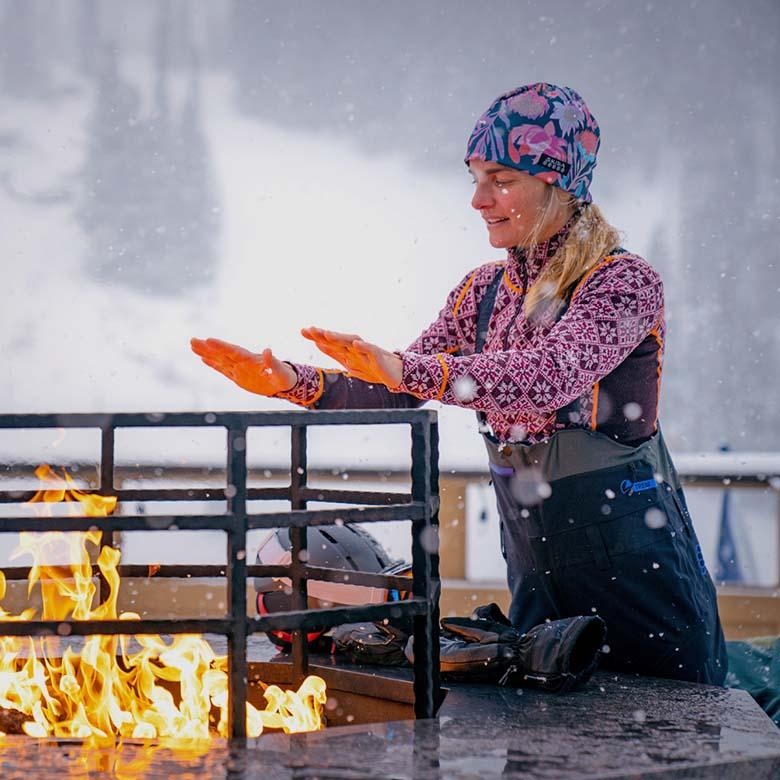 REI Co-op Holiday Warm Up Sale (standing in front of fire at lodge)