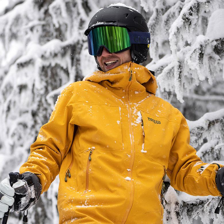 Ski jacket (snowy backdrop with Trew Gear Cosmic Primo)