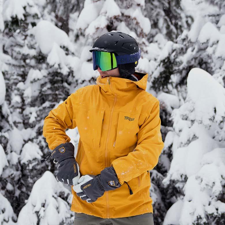 ​​Trew Gear Cosmic Primo Jacket (standing in front of snowy backdrop)