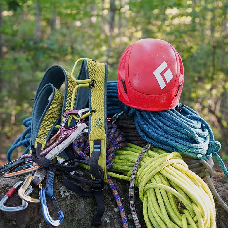 Rock climbing checklist (gear laid out on rock)