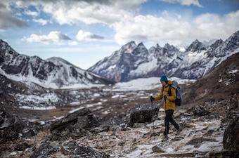 Backpacking through a snowy mountain range