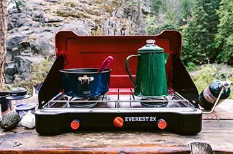 Camping stove (Camp Chef Everest 2X on picnic table)