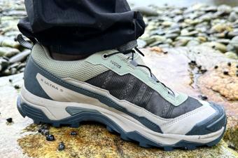 Close up of green and brown Salomon hiking shoe