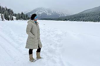 Kuhl Crossfire Parka (standing in snow looking at mountains)