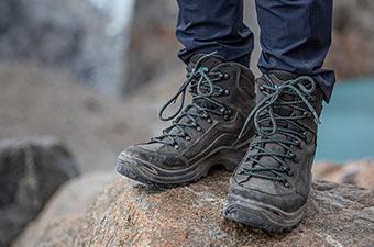 Lowa Renegade GTX Mid hiking boot (standing on rock above lake)