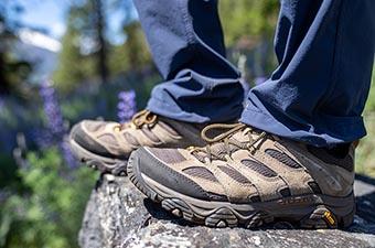 Merrell Moab 3 hiking shoes (standing on edge of rock)