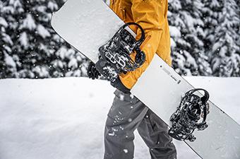 Snowboard bindings (closeup holding snowboard)