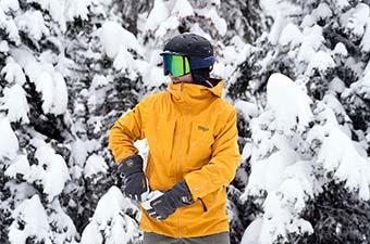 Trew Gear Cosmic Primo Jacket (snowy backdrop at resort)