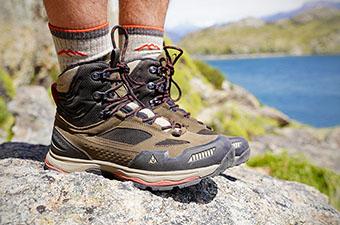 Vasque Breeze AT Mid hiking boots (standing on rock)