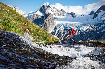 Waterproof hiking footwear (crossing mountain stream)